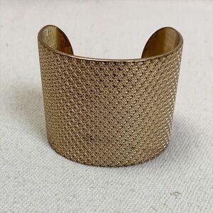 Lacoste Wide Gold tone Cuff bracelet